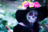 Woman wearing Day of the Dead mask