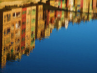 Spanish houses reflected in water